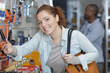 © auremar - happy female customer shopping in hardware store