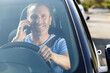 © auremar - smiling man or driver driving car and calling on phone
