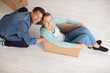 © auremar - couple have fun moving together to new apartment
