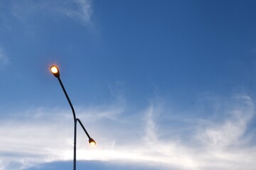 Wall Mural - electric lamp pole on cloud and sky background in evening
