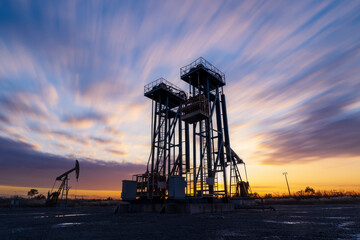 Wall Mural - In the evening, oil pumps are running, Silhouette of beam pumping unit