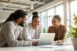 © Pixels Hunter - Diverse colleagues collaborating in a bright office environment.