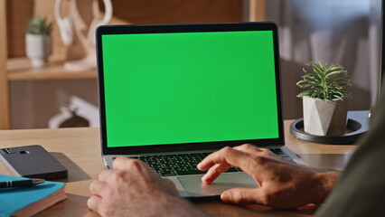 Wall Mural - Businessman fingers scrolling mockup laptop touchpad working at cabinet closeup