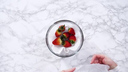 Wall Mural - Washed and Dried Strawberries Stored Safely in a Glass Bowl