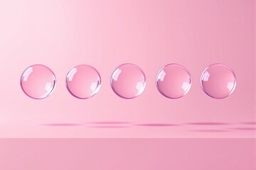 Poster - Five transparent pink bubbles floating on a soft pink background.