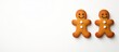 © pngking - Gingerbread cookies with smiling faces and white buttons on a plain background with copy space for text