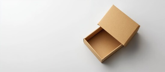 Poster - Open cardboard box on a white surface with ample copy space for text or design elements