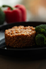 Wall Mural - Hearty buckwheat groats served with broccoli and bell pepper. A healthy and delicious meal.