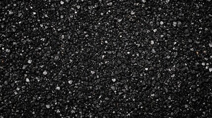 Poster - Black textured gravel surface with small stones and pebbles suitable for backgrounds and copy space.