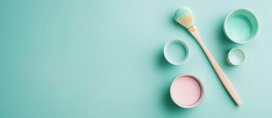 Poster - Aesthetic arrangement of pastel paint pots and a brush on a mint backdrop with ample Copy Space for design purposes.