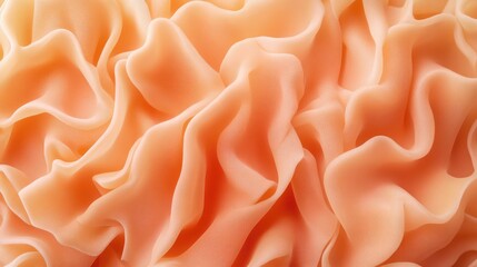 Poster - Peach colored fabric with soft folds and waves creating a textured background with Copy Space for design purposes
