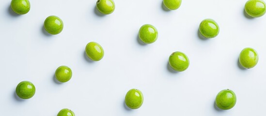 Poster - Green grapes scattered on a light background with ample copy space for text placement.