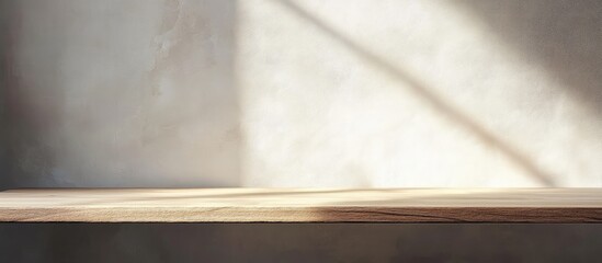 Poster - minimalist wooden shelf against a concrete wall with natural light creating shadows copy space
