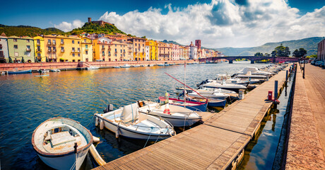 Canvas Print - Captivating summer cityscape of Bosa town with Serravalle casttle on background. Exciting outdoor scene of Temo river. Sunny mrning view of Sardinia island, Italy. Traveling concept background..