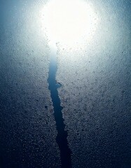 Wall Mural - closeup view capturing the intricate condensation of fog on a window glass surface, showcasing the d