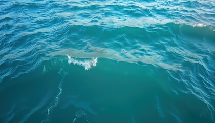 Aufkleber - Aerial view of turquoise sea waves. Calm water surface. Blue ocean with gentle ripples. Beautiful sea background. Water texture perfect for wallpaper visual media. Tranquil, relaxing vacation scene.
