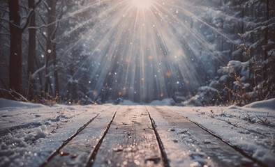 Poster - A snowy forest with a wooden bridge in the foreground. The sun is shining through the trees, creating a warm and inviting atmosphere