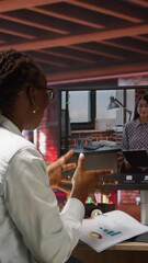 Poster - Vertical video Woman at home answering videocall from manager checking tasks progress, showing documents, presenting progress done. Teleworker in videoconference with team leader, talking about