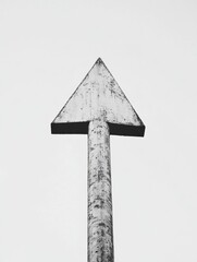 Poster - Wooden arrow sign pointing upwards against a plain sky during daylight hours. Generative AI