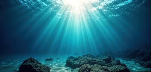 Aufkleber - Stunning underwater scene shows sunlight beams penetrating turquoise water. Dark rocks rest on sandy ocean floor. Beautiful aquatic environment. Perfect for travel advertising or nature photography.