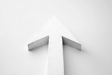 Leinwandbilder - White arrow pointing upward against a plain wall emphasizing direction and focus in a minimalist setting. Generative AI