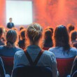 © Anzhela - Audience at Business Entrepreneurship Symposium with Speaker Presenting in Conference Hall