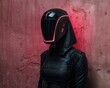 © Balaraw - Futuristic female robot in black suit and helmet with pink neon lights, standing against a pink wall