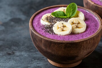 Delicious purple smoothie bowl with banana and chia seeds