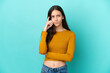 © luismolinero - Young French woman isolated on blue background having doubts