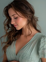 Wall Mural - Woman with long brown hair and a green dress is smiling