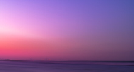 Wall Mural - sunset sky background,sunrise sky on summer sea beach,panoramic winter evening by the sea with drama