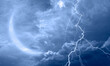© muratart - Lightning strikes between blue stormy clouds with crescent moon
