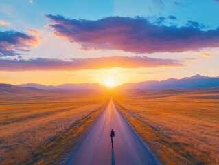 Poster - A Person Strolling Along a Quiet Road Surrounded by Breathtaking Scenery as the Sun Sets Casting Warm Hues Across the Evening Sky and Landscape