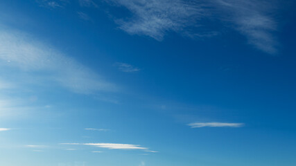 Wall Mural - beautiful blue sky with soft white clouds for abstract background