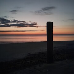 Wall Mural - scenic beach sunset with unobstructed horizon at dusk