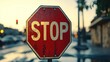 © Ali - Here's a 10-word description: Wet stop sign, blurred background, sunset,