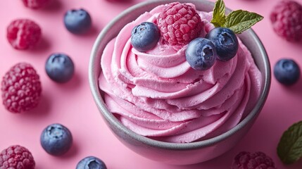 Wall Mural - Pink dessert topped with fresh raspberries and blueberries