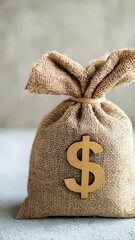 Poster - Full burlap money bag tied with twine sits on a textured surface, a large gold dollar sign affixed to its front, symbolizing savings, investment, and financial growth