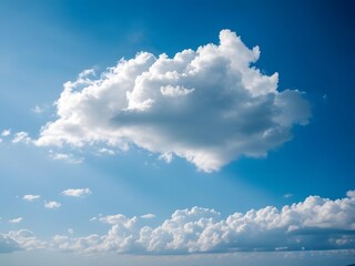 Wall Mural - a single white cloud in the clear blue sky, with a touch of soft shadow