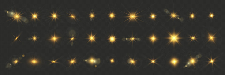 Aufkleber - Set of bright gold beautiful suns with light flares on a dark background. Flashing light effects, sparkling details, and a luxurious radiant appearance. Suitable for festive, decorate.	