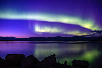 Wall Mural - northern lights dancing over lake torne trask . abisko national park in north of sweden.