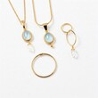 © Biggy - Elegant Gold Jewelry Collection with Blue and Clear Gemstones