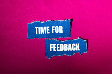 Wall Mural - Time for feedback message written on ripped torn blue paper pieces with pink background. Conceptual time for feedback symbol. Copy space.