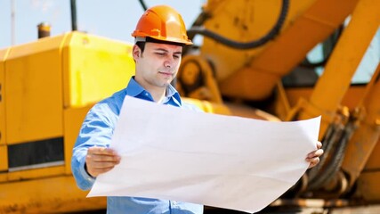 Wall Mural - Engineer reading blueprint on construction site near excavator