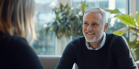 Fototapete - A professional customer service representative interacts positively with clients, offering a friendly smile and attentive listening in a modern office.