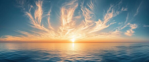 Wall Mural - Dramatic sunset over calm ocean with vibrant sky.