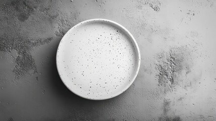Poster - Empty white plate on a textured gray surface.