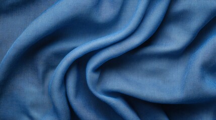 Smooth blue fabric flowing and creating soft waves, perfect for backgrounds or textures