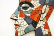 © Татьяна Евдокимова - Profile of a human face created using a mosaic technique with multicolored tiles, showing cubist influences