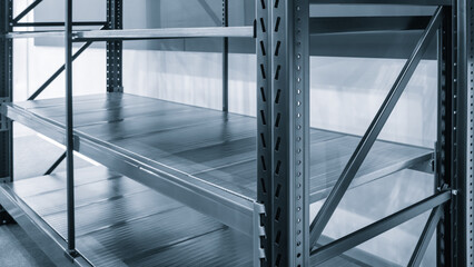 Fototapete - Interior of the new and modern empty shelves warehouse space